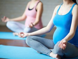 pregnant women doing yoga